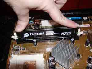 Hold memory module by the edges